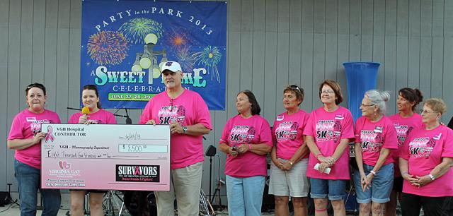 Cancer survivors present a $8,500 check to VGH Foundation Director Mike Timmermans.