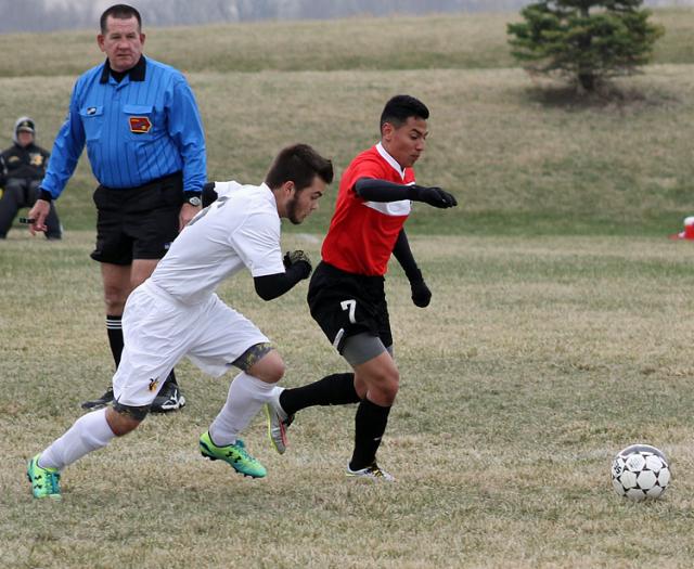 Quinton Guenther races to the ball during the Vikings' contest with W. Dubuque.