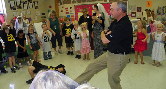 Dancing Principal: Mr. Murray joins the Q and U wedding celebration.