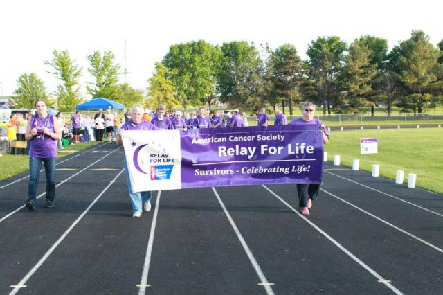 Cancer survivors walk their lap during the Relay for Life Friday in Vinton.