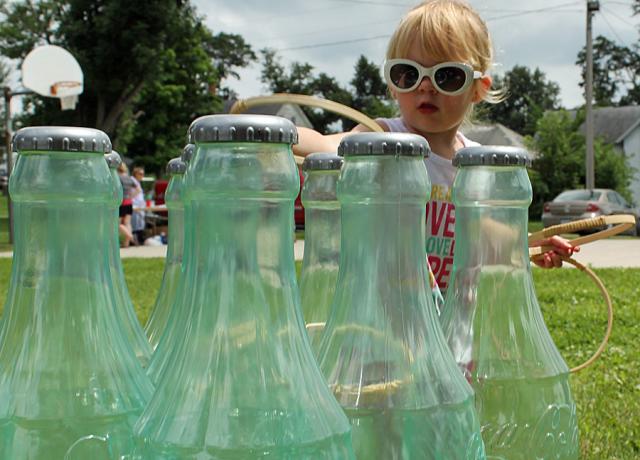 Children played a variety of games during Garrison's Fun Day; Kali Decker tries the ring game here.