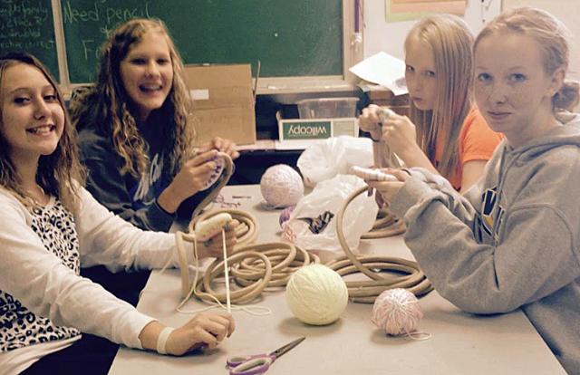 (In the picture, students work on an art project; the photographer was part of an RTI class, too.