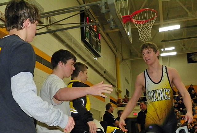 Viking wrestlers congratulate Ryan Webster on his school record-tying 26th pin Tuesday at VSMS.