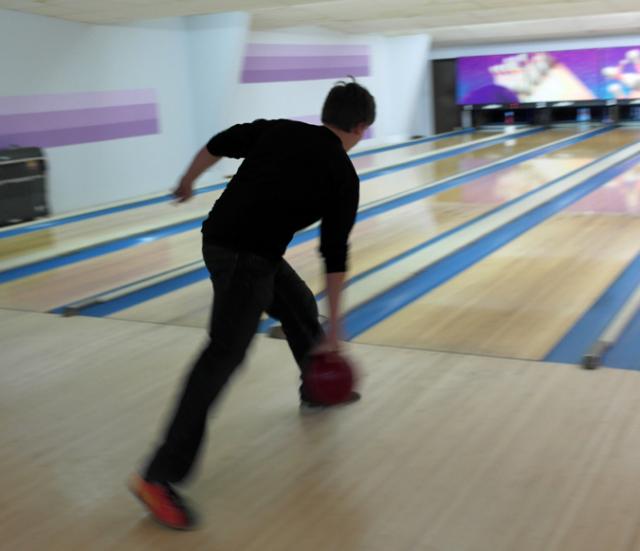 Ethan Henry bowls at the 2014 VS FFA Holiday Party.