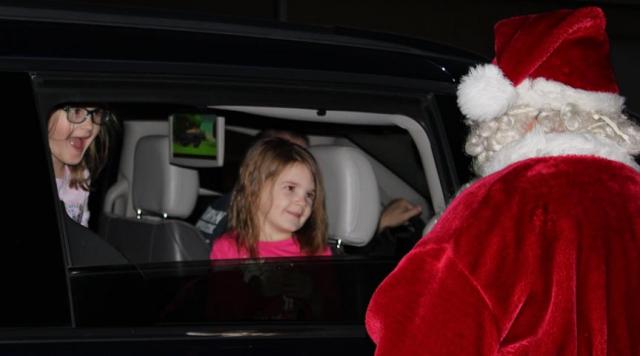 Santa makes area children smile by simply appearing
