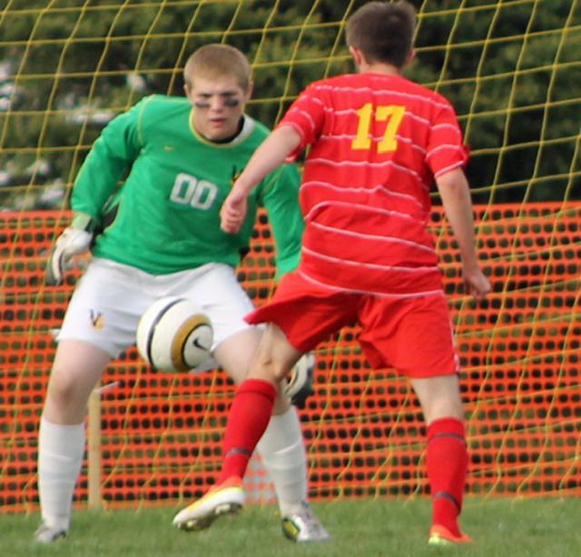Logan Davis vs. Trevor Moyer of Vinton: Viking Goalie prepares to defend the goal.