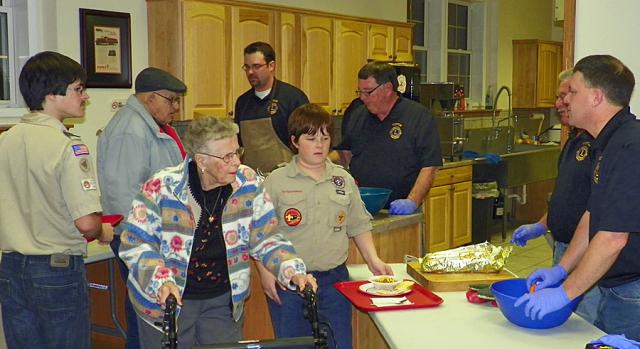 Vinton Lions and Scouts help serve the meal for the Honor Flight fund-raiser.