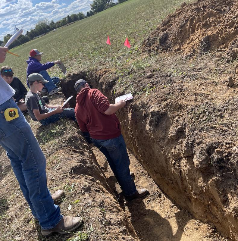 Members got to be hands on in the pits. Andrew Pingenot is seen measuring horizons inside of a pit.