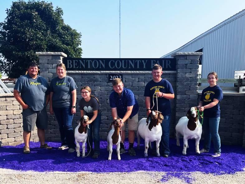 Mentors Steven and Emma Henry with Gina Lutgen, Clayton McKenna, Will McKenna, and Megan Schlitter and the breeding goats they exhibited.