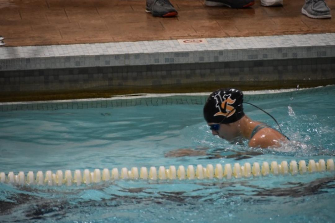 Olivia Schminke competes in the Waterloo swim meet, swimming the breast stroke.