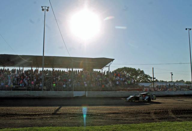 Dakoda Sellers rolls around the track as part of the Urbana 5 memorial parade.