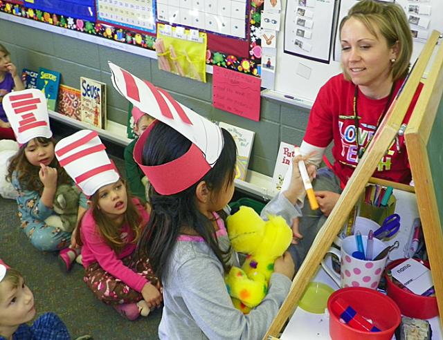 Angela Ahrenstein answers a question for Mrs. Newton during Dr. Seuss' birthday.