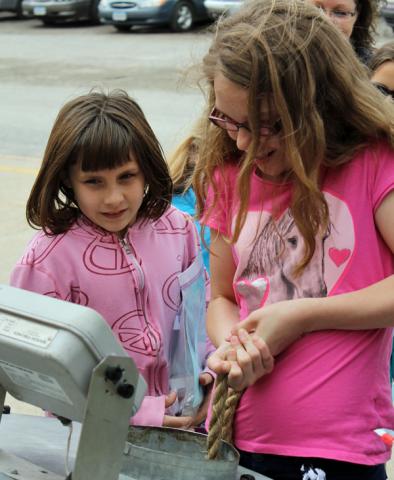 Children learned how hard it is to pull someone from a grain bin during State Fair Day at Tilford.