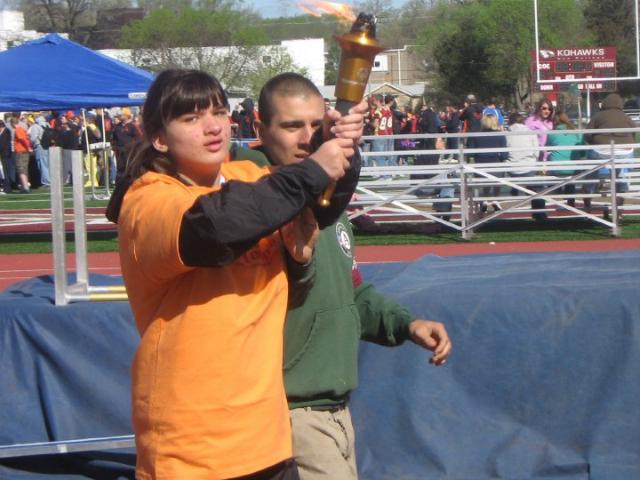 Shelby Arp carries the torch at the beginning of the Special Olympics Regional at Coe College.
