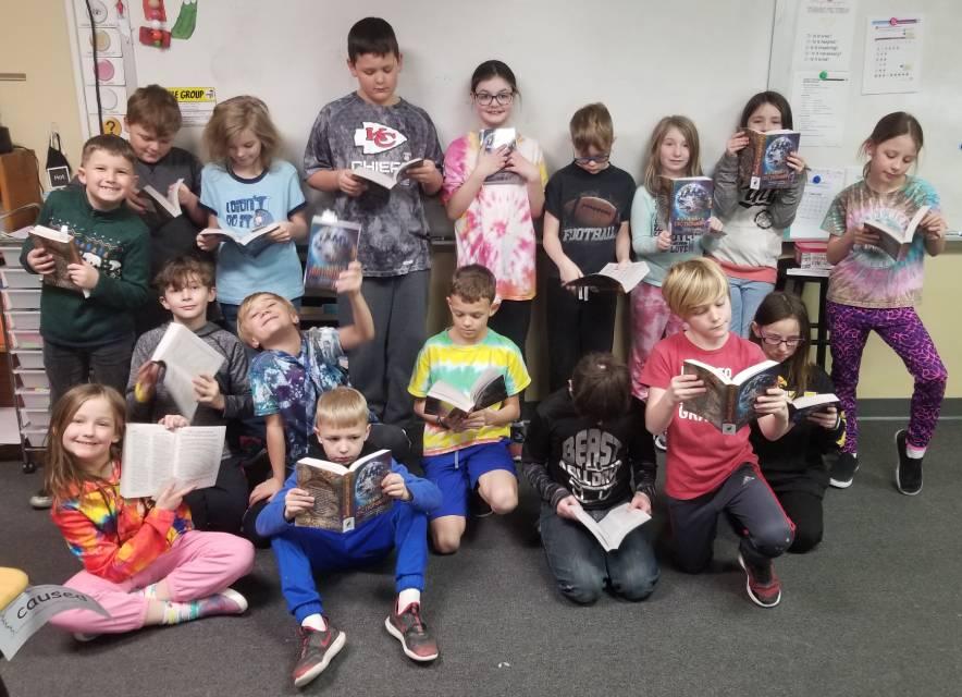 Students in Shellsburg Elementary pose with the new dictionaries received from the Vinton Kiwanis
