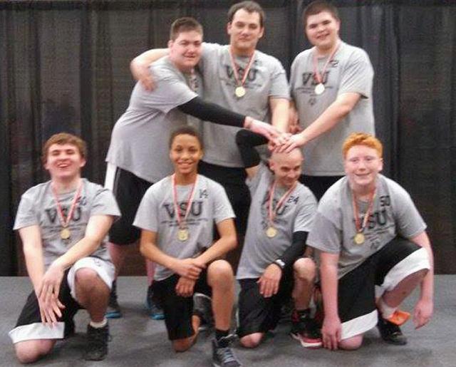 VSU boys celebrate their gold medal in the Winter Games basketball tourney.