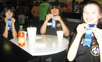 Morrigan Hubbard, Shelby Arp, and Dani Koopman of the V-S Special Olympics are all smiles.