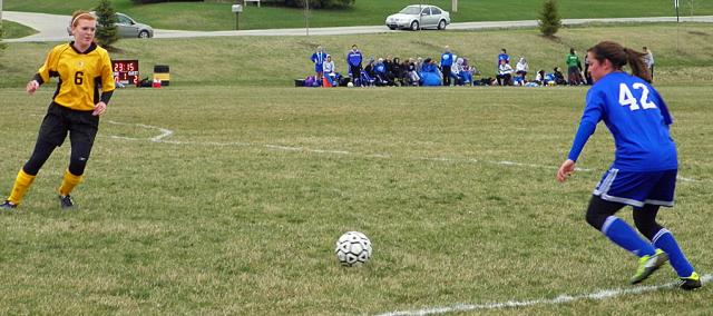 Danisha Pladsen defends as a CCA player puts the ball in play.