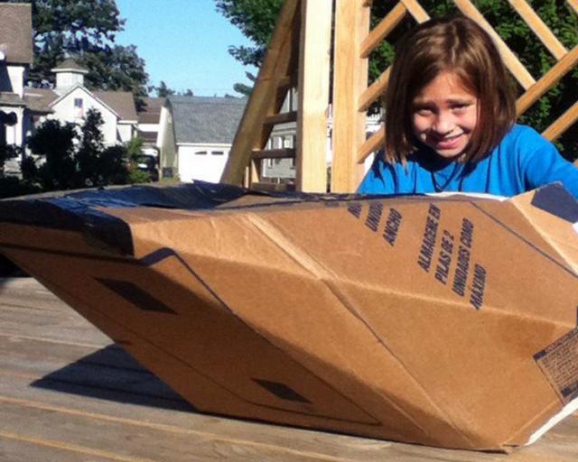 Cardboard boating: Sophia Vasquez in replica USS Keokuk, a 2-turreted ironclad steamship from 1862.
