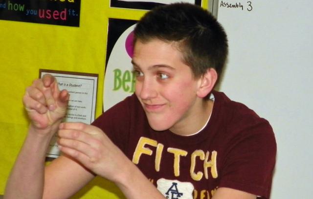 Alex Springer rehearses his 'Dr. Jekyll and Mr. Hyde' State Speech mime act in Mr. Upmeyer's room.