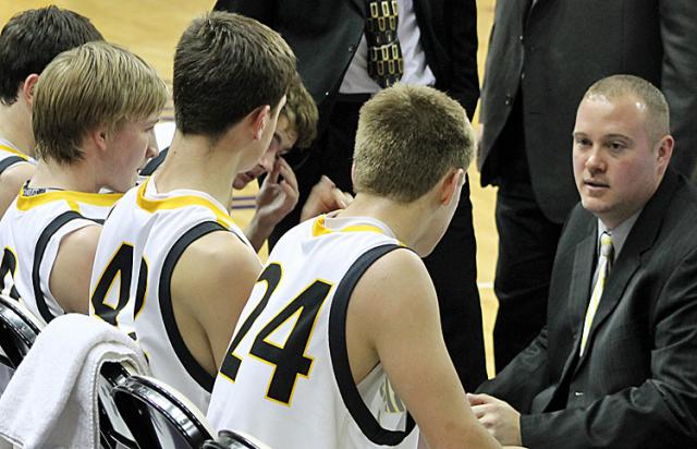 Coach Johnson speaks to his team in the first quarter.