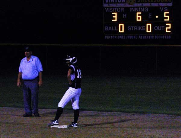 Ashley Strong stands at second base after her two-run single in the sixth inning.