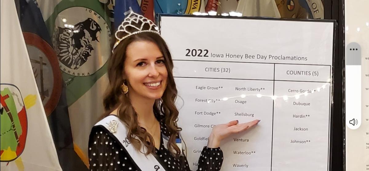 Caption could be: ISU Jr. & 2022 Iowa Honey Producers Association Queen Allison Hager, Bellevue, IA highlights Shellsburg on Iowa Honey Bee Day, March 30th.