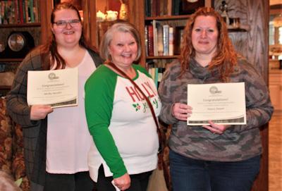 Roxanne Ervin, P.E.O. Chapter HG member (middle) awards $3000 Continuing Education Grants to Shelby Stender, Vinton (left) and Darcy Duhart, Urbana (right).