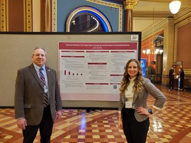 UNI student Grace Petrzelka, Vinton at the Capitol presenting her research on Maternal Mortality on 2/21/22