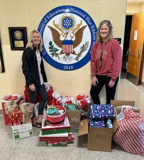 Sue Wilber (left) and Melissa Smith (District Nurse) are pictured with donations made by Benton County Employees