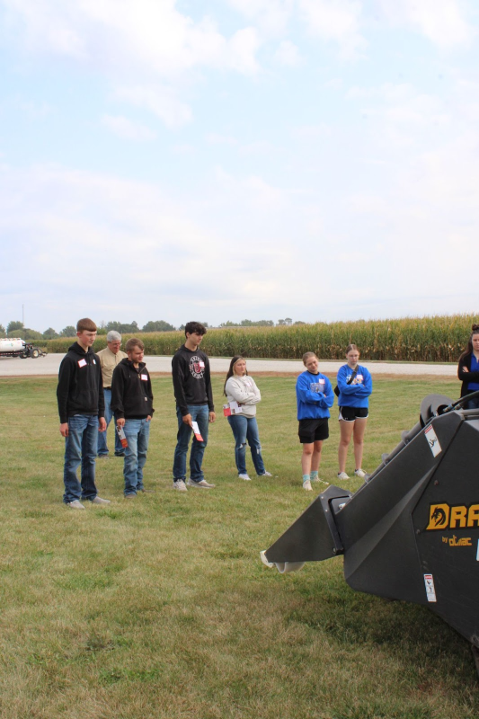 Will Kreutner and others, learning about the different parts of a combine.