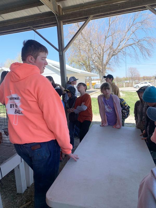 Andrew Pingenot teaches 3rd graders about rabbits and poultry at 3rd Grade Ag Day.