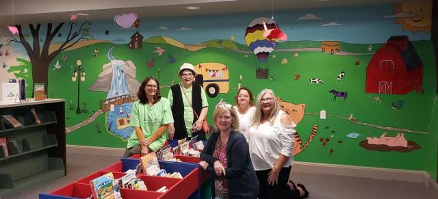 Members of Vinton's Guild of Fine Arts complete the first Mural in the Library