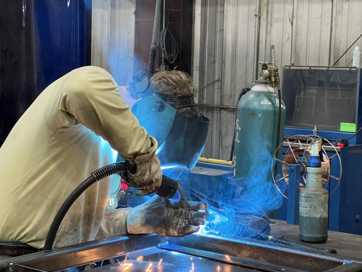 Students learn about welding at Ideal Industries