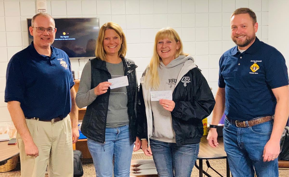 Rob Levis, KC Financial Secretary; Melissa Tandy, ARC Board Member; Tammy Zimmerman, VSU Special Olympics; Billy Ollinger, KC Grand Knight. Not pictured Miles Wood, Tootsie Roll Drive coordinator.