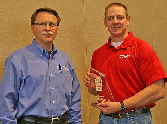Eric Dickinson, right, has received the ILEETA Trainer of the Year Award