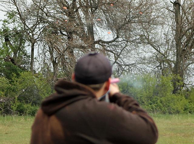 The target breaks in pieces after being hit by Curtis Geiger's shot Saturday.