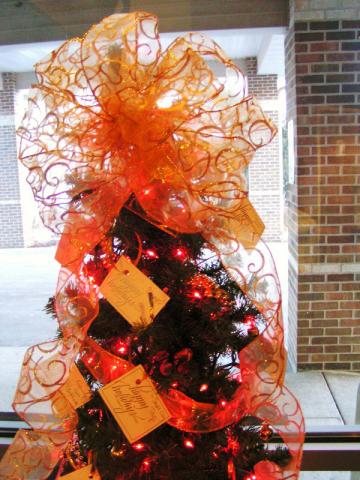 Miracle Tree arrives at Vinton Lutheran Home to assist the elderly at Christmas stop in choose a tag