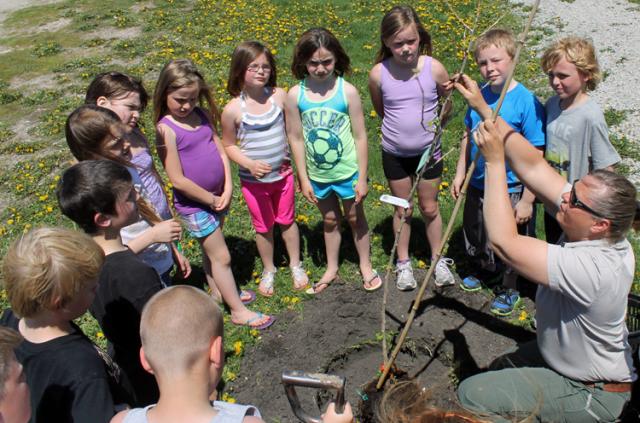 Laura Wagner of the DNR Trees for Kids program explains the basics of tree planting.
