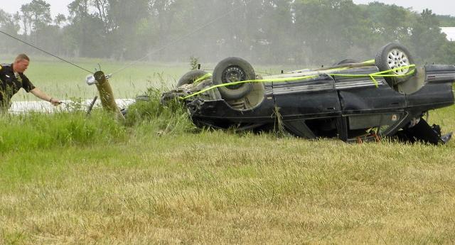 A teen driver escaped serious injury when her car flipped and hit a pole Monday north of Vinton.