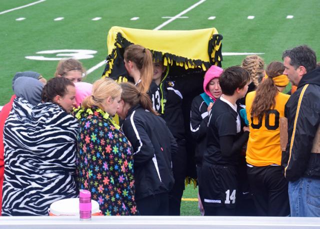 Brrrr... Vikettes try to stay warm during half-time of soccer win at Benton.