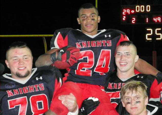 Union linemen celebrate Wes Burnside's record-setting season by putting him on their shoulders.