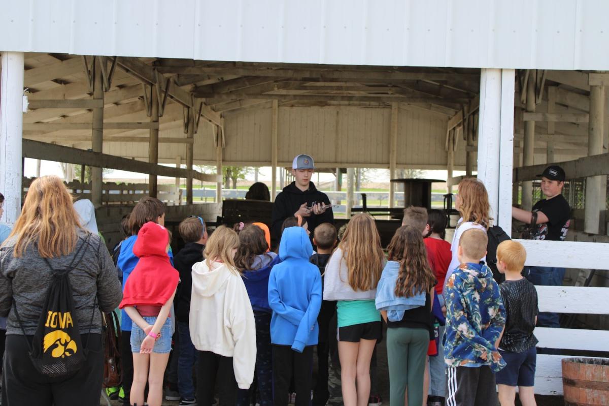 Vinton-Shellsburg FFA members: Jameson Demuth and Caleb Blattler teach 3rd graders about horses.