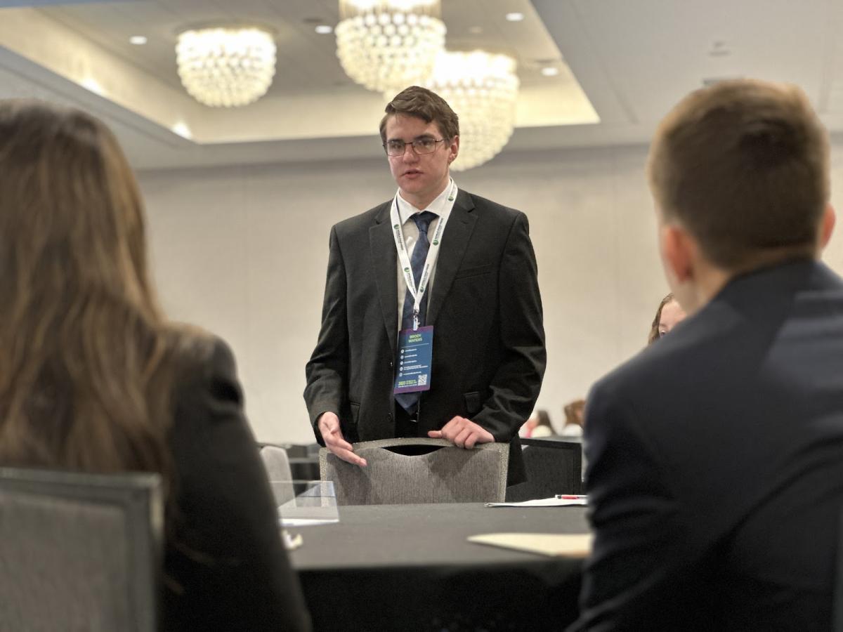 Brody Waters makes presentation to other contestants from around the world.