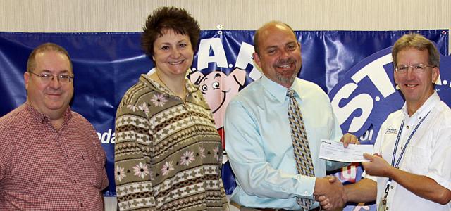Coalition donation: Greg Walston, Karen Larson & Scott Hansen with Jon Kremer of US Bank.