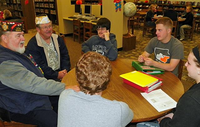 Don Roepke, left, & Ron Geiger told the students of the friendly rivalry between military branches.