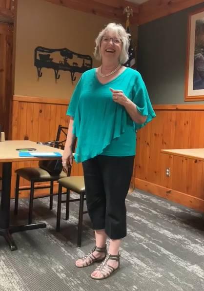 Victoria Fink shares with the local Kiwanis the services offered by E.C.H.O. and Abundant Life Ministries