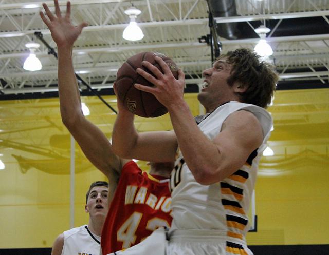 Chris Merchant drives toward the basket; the Vikings defeated Marion, 70-48.