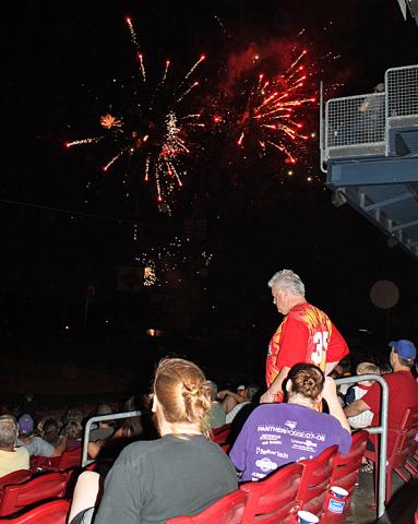 Vinton residents watch the fireworks after the game.