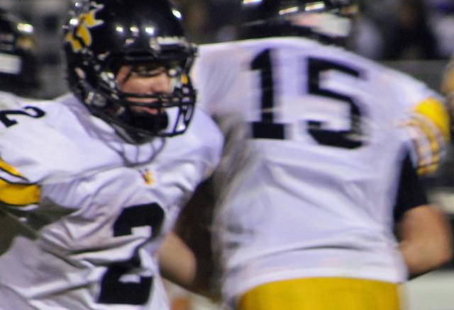 Reverse: Nick Hyland (2) hands off to Tanner Spies (15).